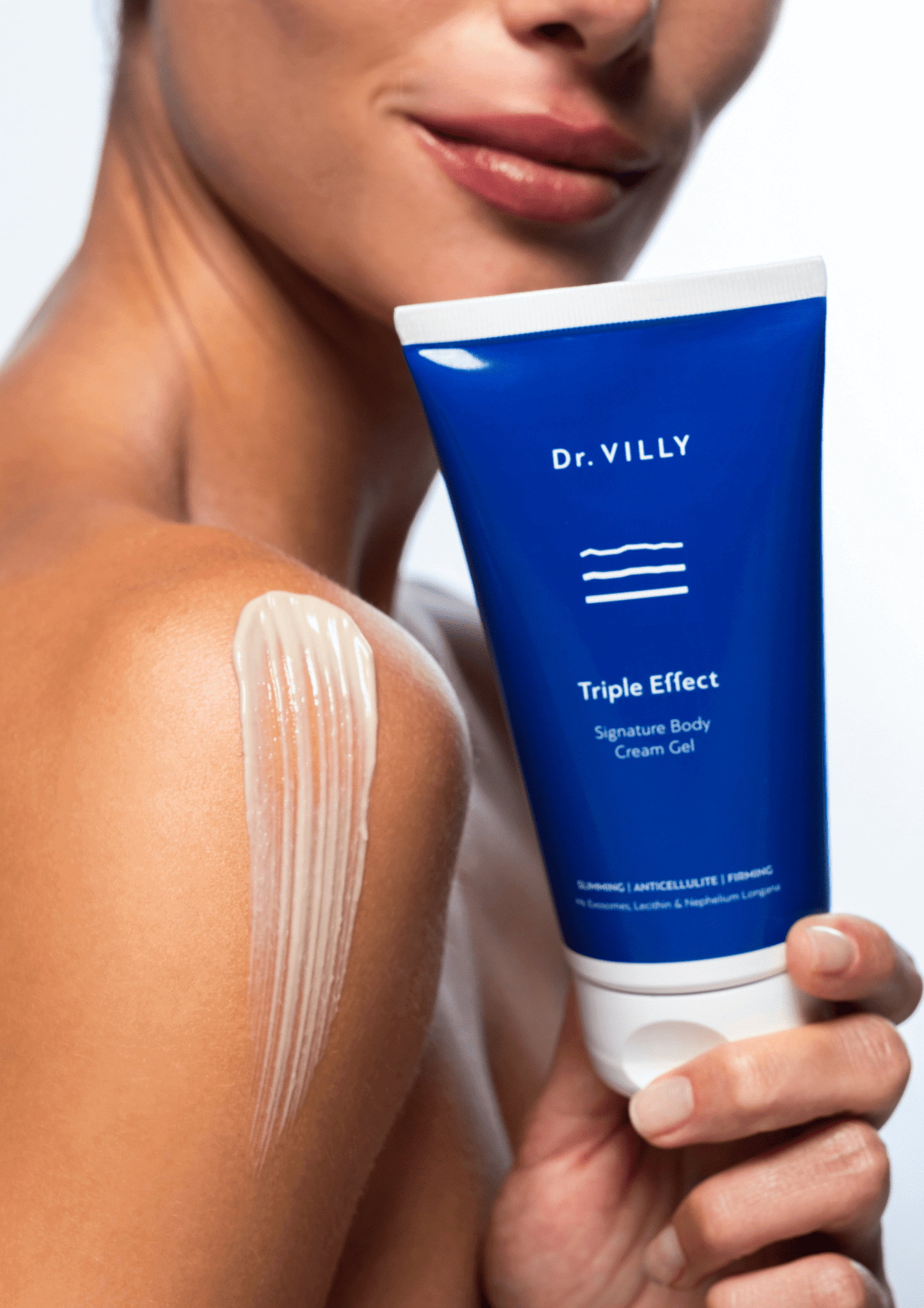 Image of model holding an 150 ml of Triple Effect Body Cream Gel with Patented Citrus Exosomes by Dr. Villy Skincare, a medical Grade cream gel with anti‑cellulite, firming and toning properties for all skin types.